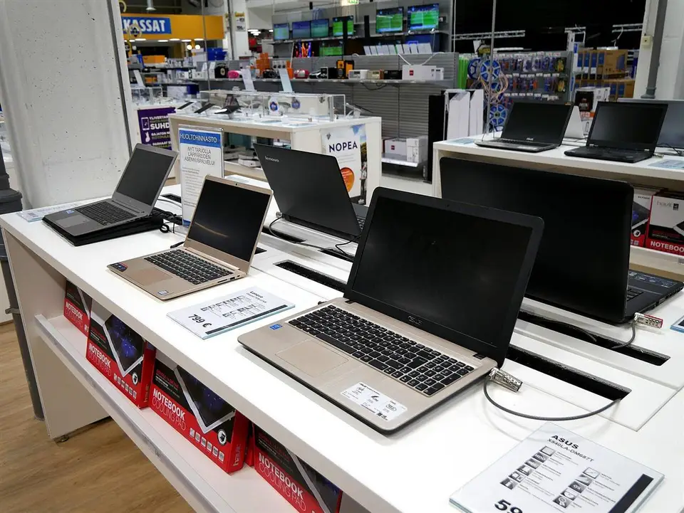 Laptops displayed on a retail counter